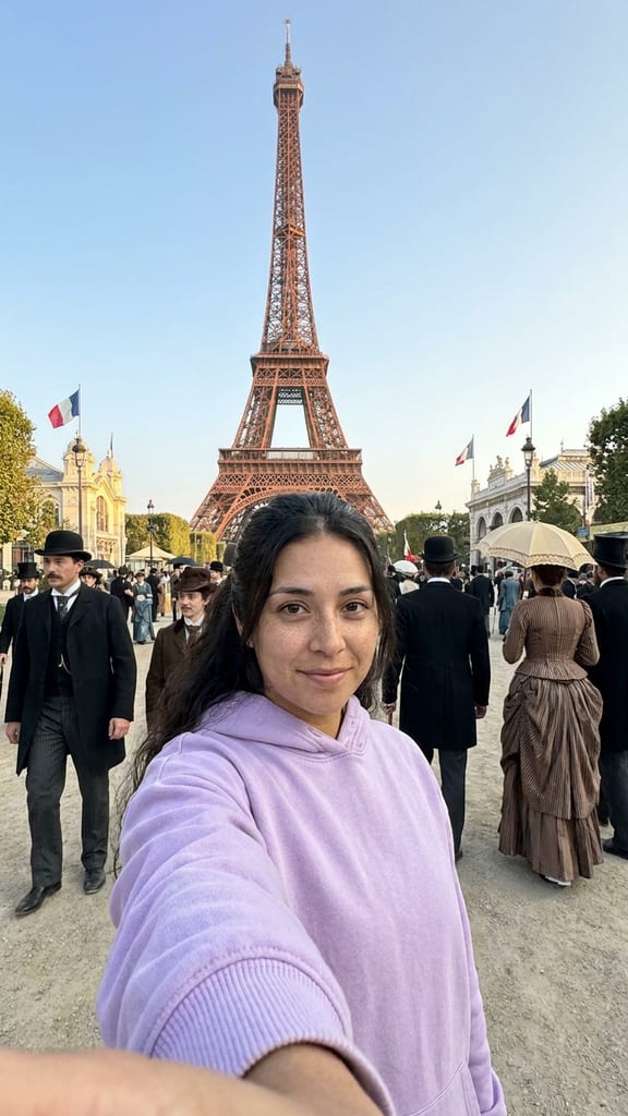 Jess Rivera filming a selfie vlog in Paris, 1889, the Eiffel Tower opens